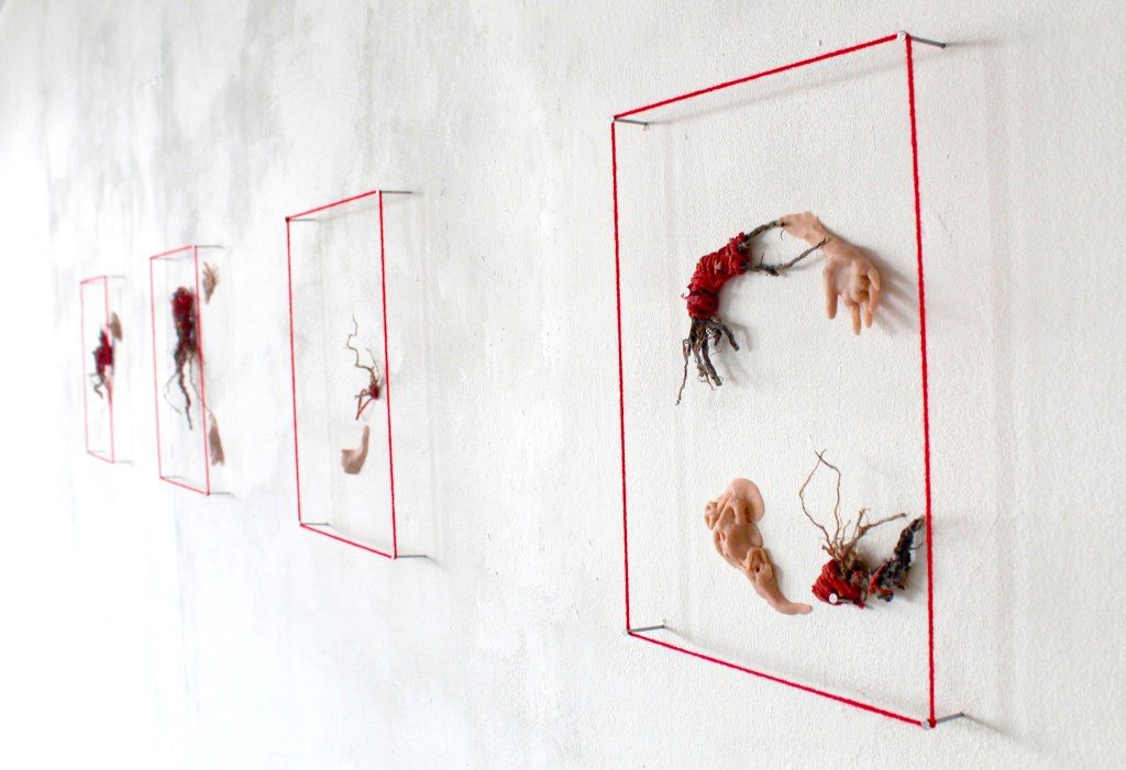 "metamorphoses"
30x124x2,5 
polymer clay, dandelion roots, red dtring
2023